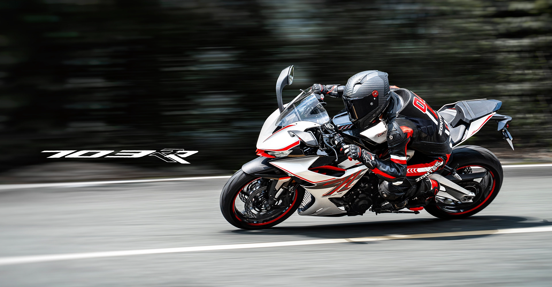 Zontes Moto San Isidro - Hero 703RR Zontes Motos San Isidro - Moto Zontes 703RR en conducción deportiva con logo del modelo
